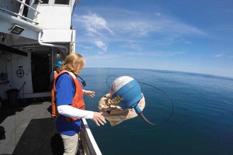Susan Dee  lletting go of a buoy during a Teacher at Sea cruise.