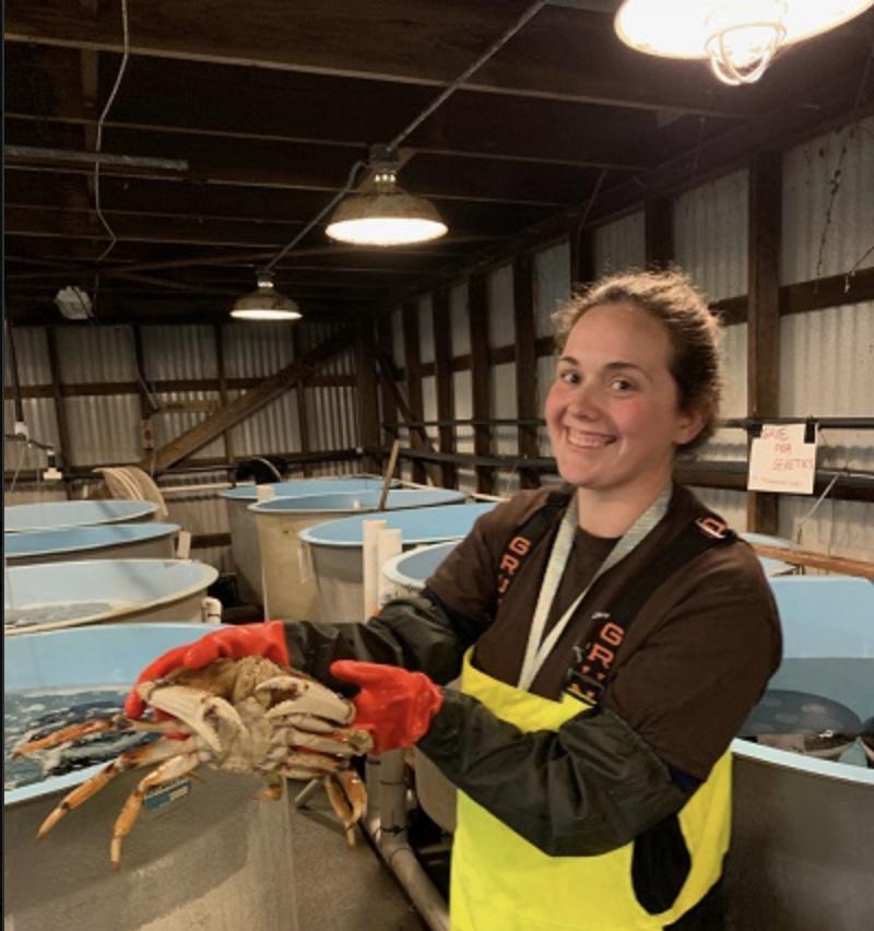 Veteran and intern Katherine Rovinski assisted with experiments on Dungeness crab. Credit: NOAA Fisheries