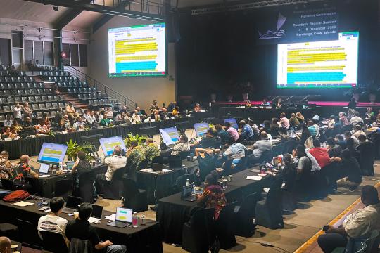 A large meeting taken place in an auditorium